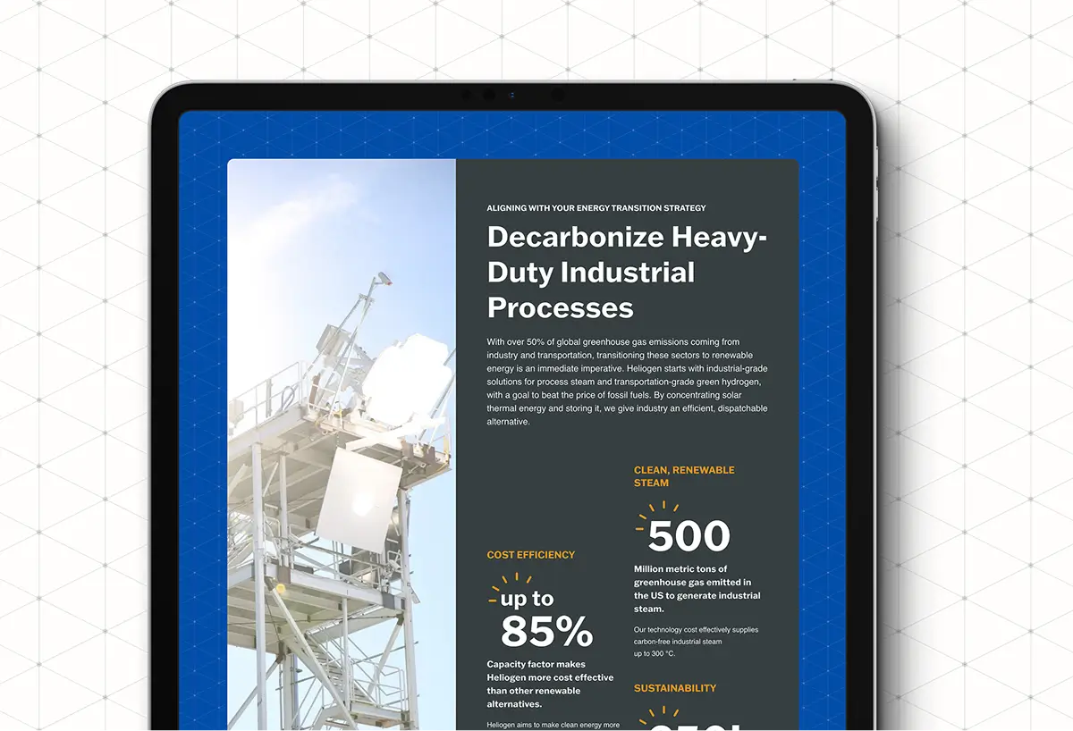 Tablet displaying Heliogen webpage about decarbonizing heavy‑duty industrial processes with a solar tower image and key performance metrics.