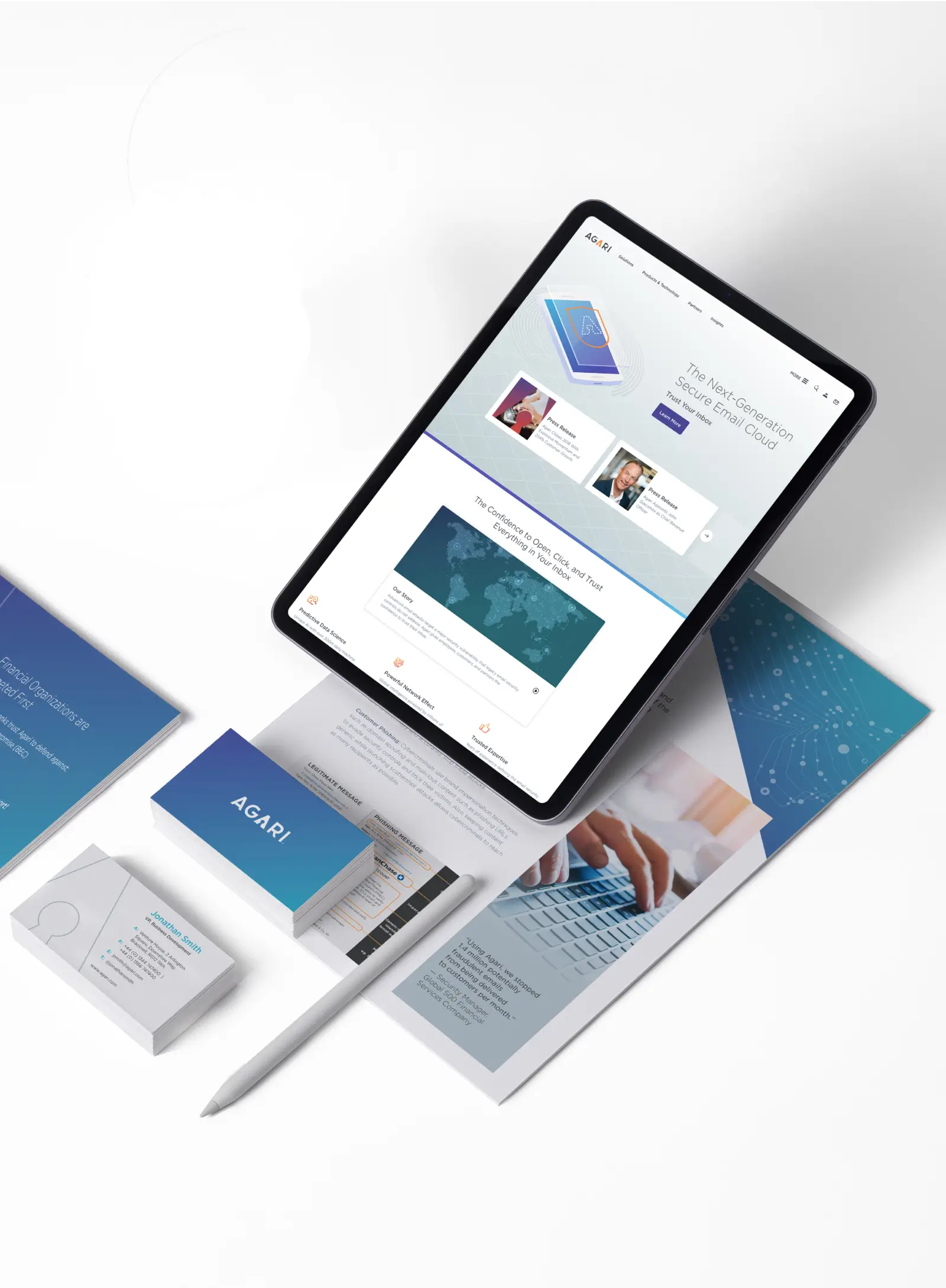 Agari-branded tablet, brochures, and business cards arranged on white desk.