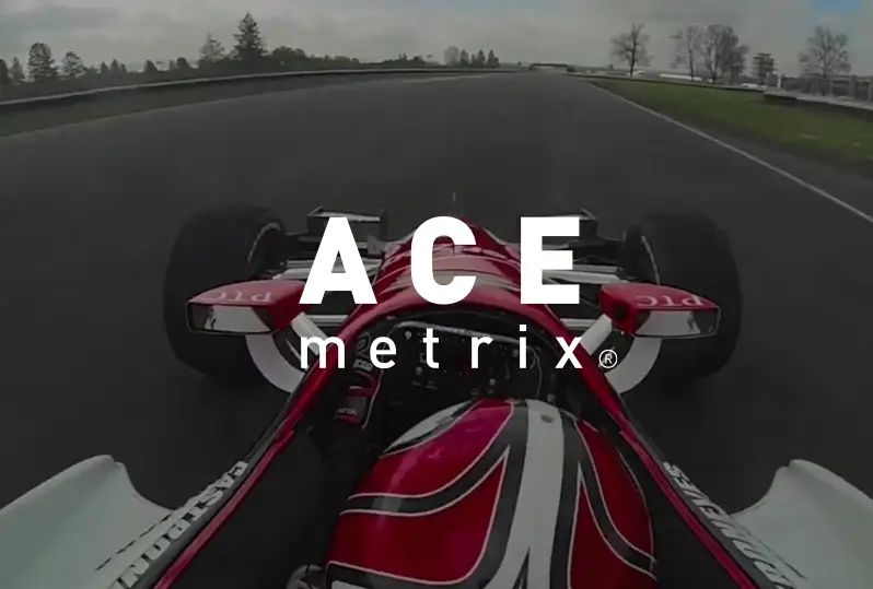 ACE Metrix logo over POV shot from a racing car driving on a track.