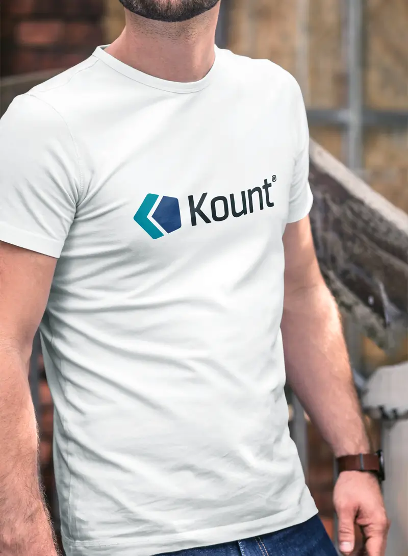 Person wearing a white Kount branded t-shirt