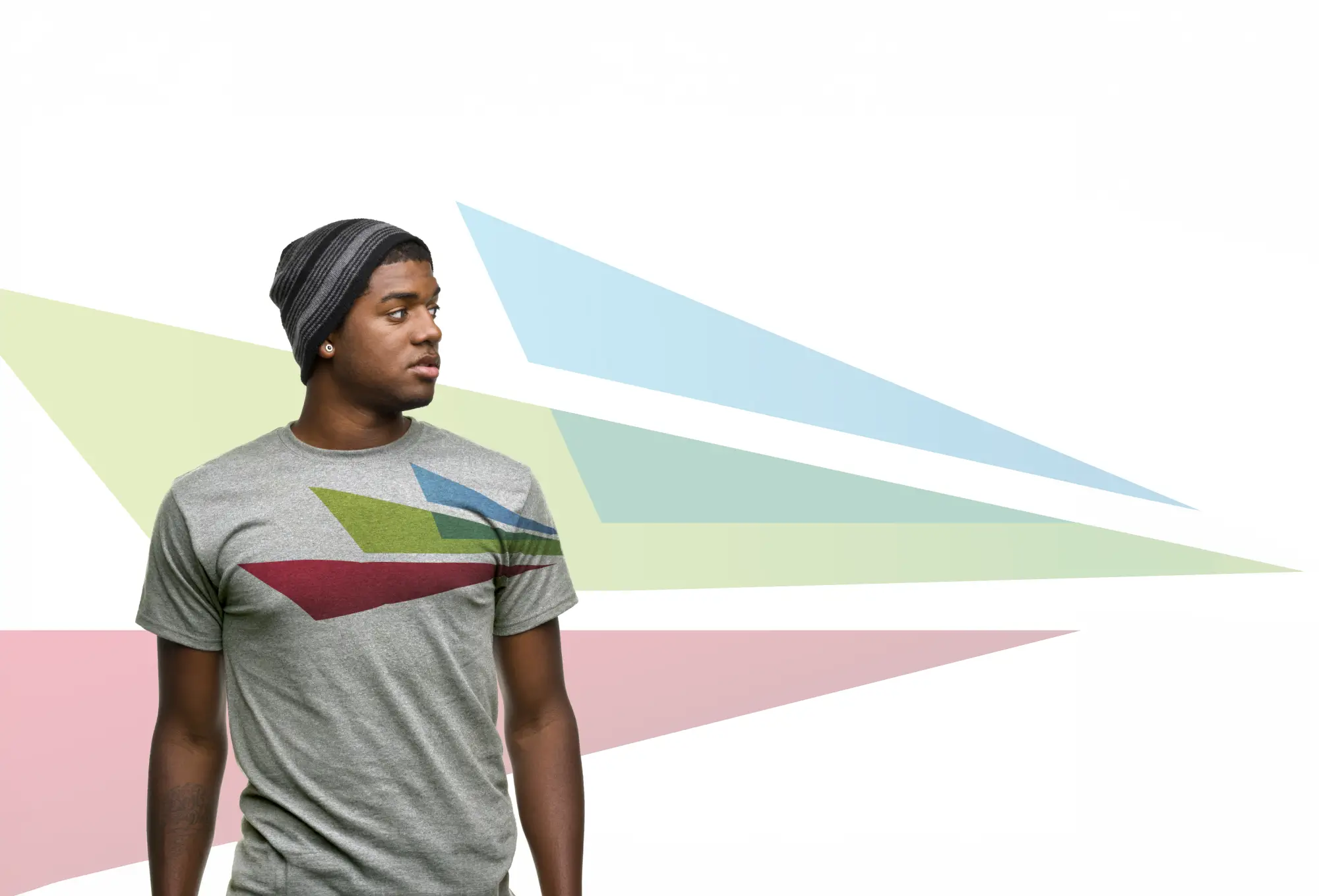 Person wearing a branded graphic t-shirt with abstract geometric shapes.