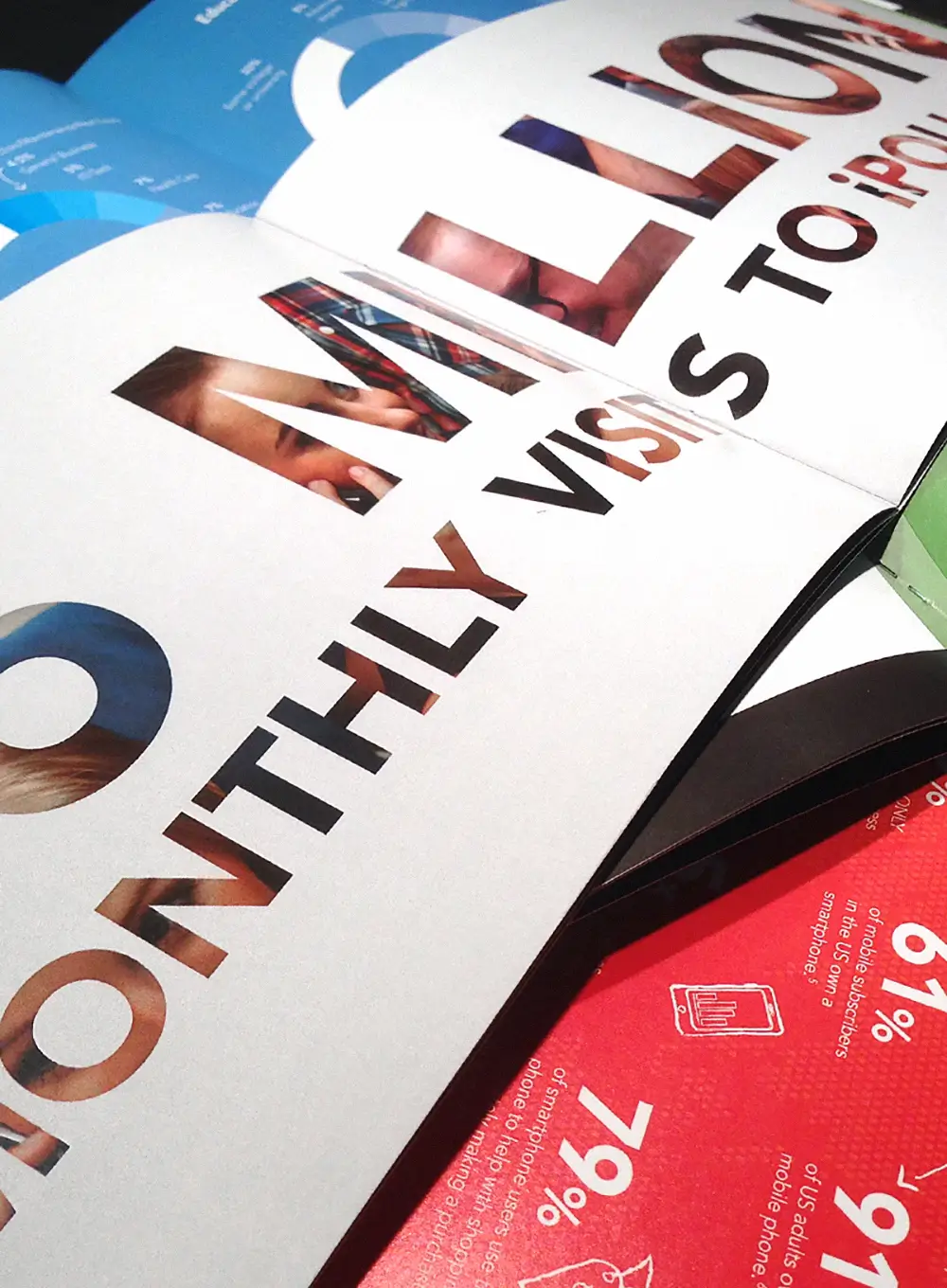 Open marketing booklet featuring bold typography and colorful infographic pages.